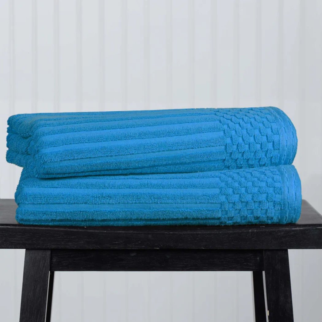 Two-piece bath towel set made of cotton with a ribbed texture, designed for ultra-absorbency. The towels are soft, durable, and feature a classic, simple style, perfect for everyday use